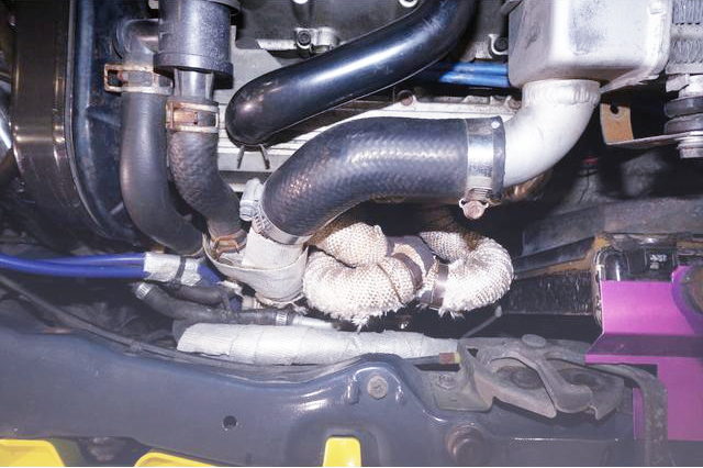 EXHAUST MANIFOLD ON K6A ENGINE