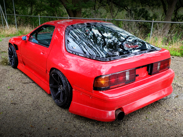 REAR EXTERIOR OF FC3S RX-7 With BN-SPORT BODY KIT AND RED PAINT.