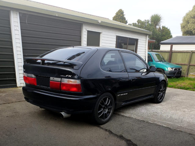 REAR EXTERIOR OF AE101 COROLLA FX GT TO BLACK.