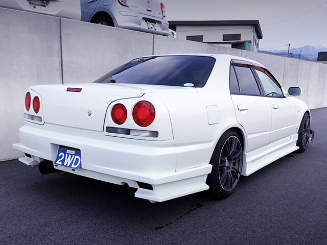 REAR EXTERIOR OF R34 4-DOOR with White.