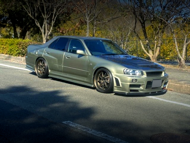 FRONT RIGHT-SIDE EXTERIOR of GT-R STYLE WIDEBODIED HR34 SEDAN.