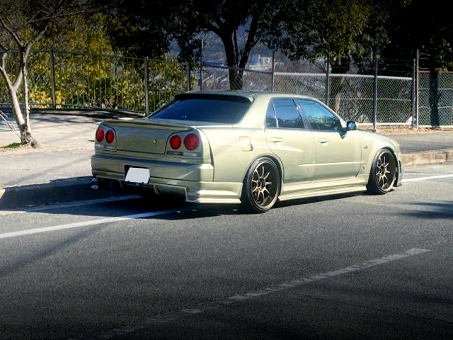 REAR RIGHT-SIDE EXTERIOR of GT-R STYLE WIDEBODIED HR34 SEDAN.