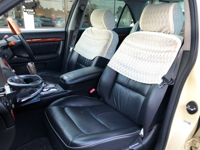 BLACK LEATHER SEATS With SEAT COVERS.