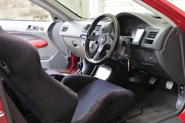 INTERIOR of RED EJ7 CIVIC COUPE.