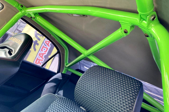 GREEN PAINTED ROLL CAGE.