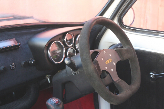 Dashboard and Steering Wheel of 2nd Gen FIAT 500.