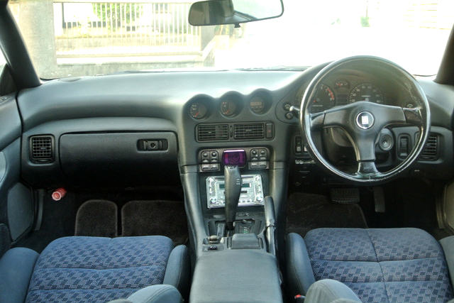 Interior of God's Mitsubishi GTO.