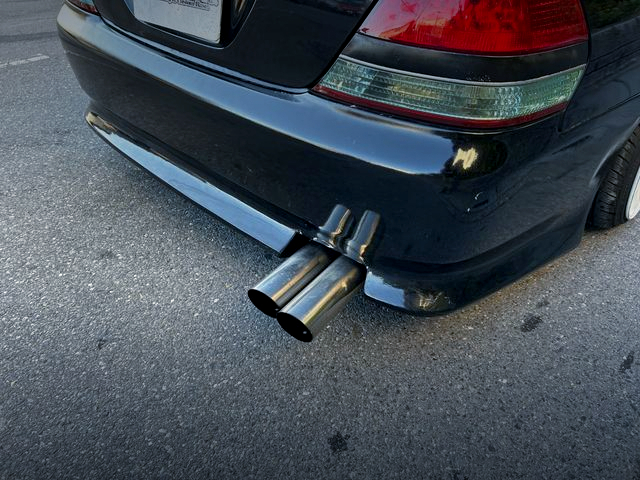 Aftermarket dual muffler.