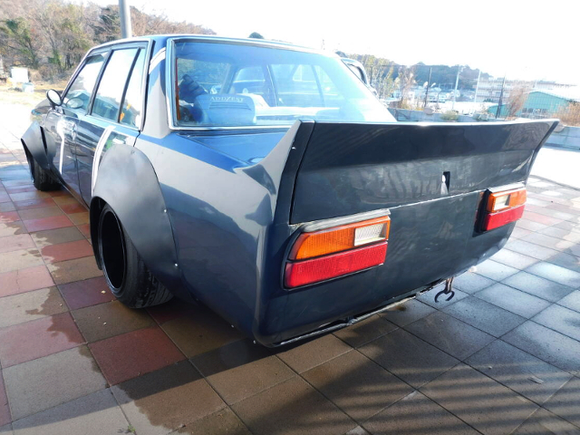 Rear exterior of JDM WORKS Flares widebody P910 BLUEBIRD.