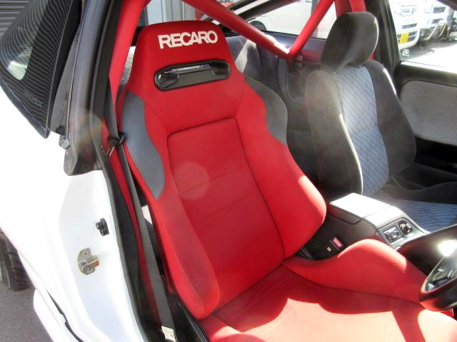 RECARO seat and roll bar.