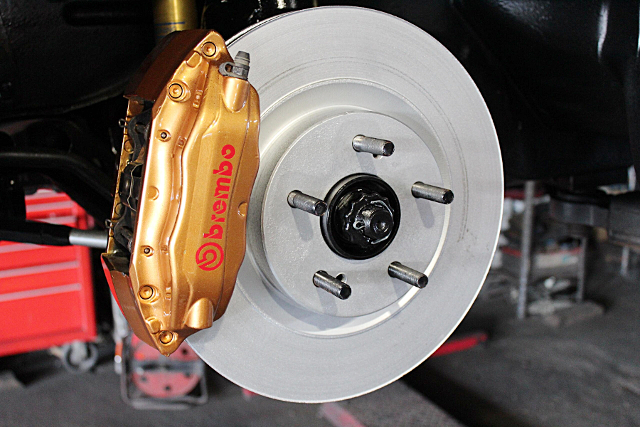 Brembo 4-pot brake caliper.