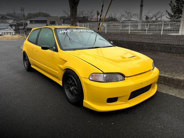 Front exterior of YELLOW EG6 CIVIC.