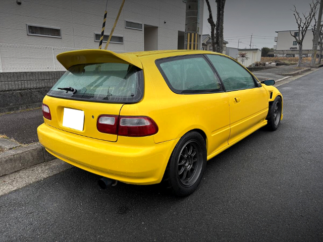 Rear exterior of YELLOW EG6 CIVIC.