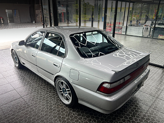Rear exterior of AE101 COROLLA 4-DOOR SEDAN.