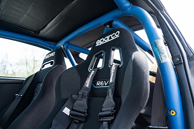 Roll cage and Bucket seats.