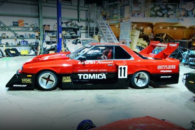 Side exterior of SUPER SILHOUETTE WIDEBODY DR30 SKYLINE 2000 TURBO RS-X.