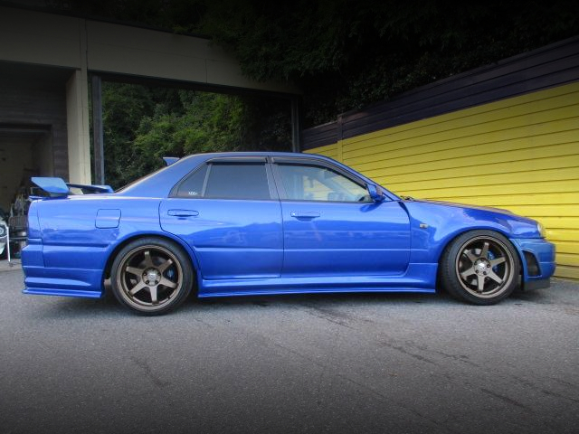 Side exterior of GT-R STYLE WIDEBODY ER34 SKYLINE 4-DOOR 25GT-X.