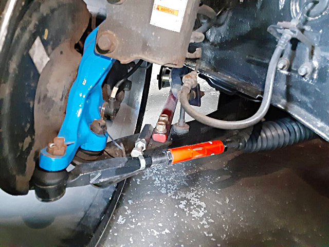 Aftermarket Adjustable Arm.
