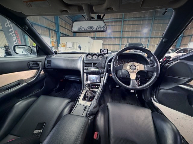 Interior dashboard of KUHL-RACING WIDEBODY ER34 SKYLINE 2-DOOR 25GT TURBO.