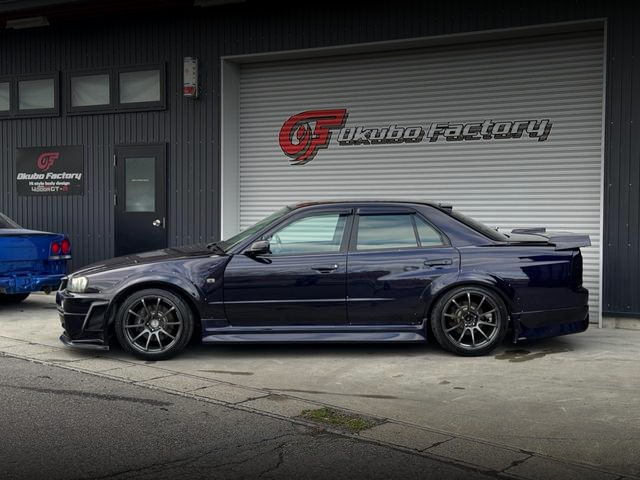 Side exterior of URAS WIDEBODY R34 SKYLINE 4-DOOR.