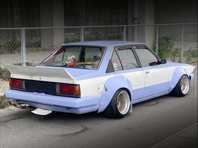 Rear exterior of JDM WORKS WIDEBODY AA63 CARINA 4-DOOR.