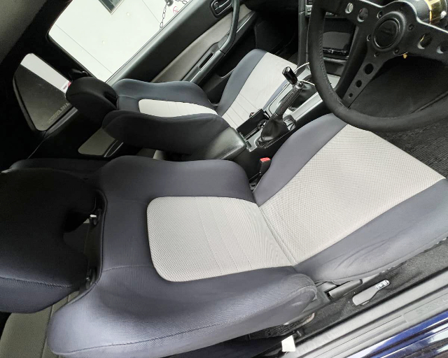 Front seats of URAS SUPER WIDEBODY ER34 SKYLINE 2-DOOR 25GT TURBO.