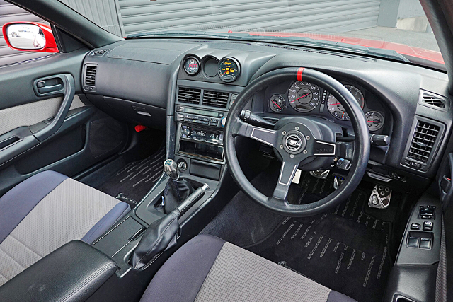 Dashboard of Active red ER34 SKYLINE 2-DOOR 25GT TURBO.