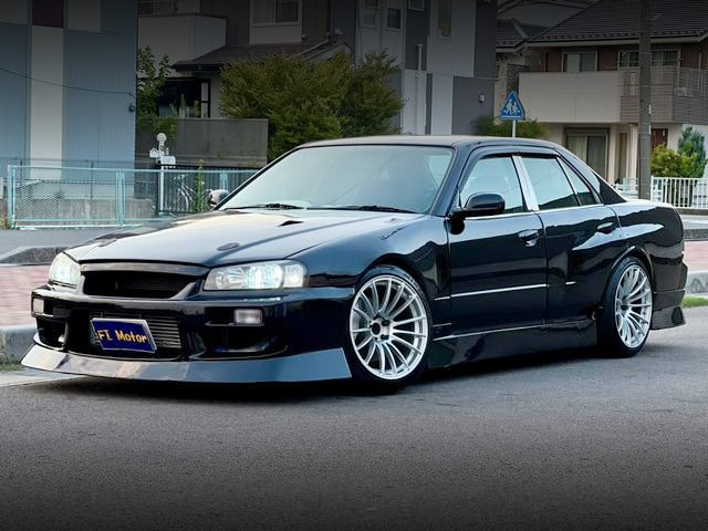 Front exterior of WIDEBODY ER34 SKYLINE 4-DOOR 25GT-X TURBO.