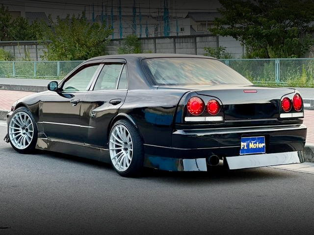 Rear exterior of WIDEBODY ER34 SKYLINE 4-DOOR 25GT-X TURBO.